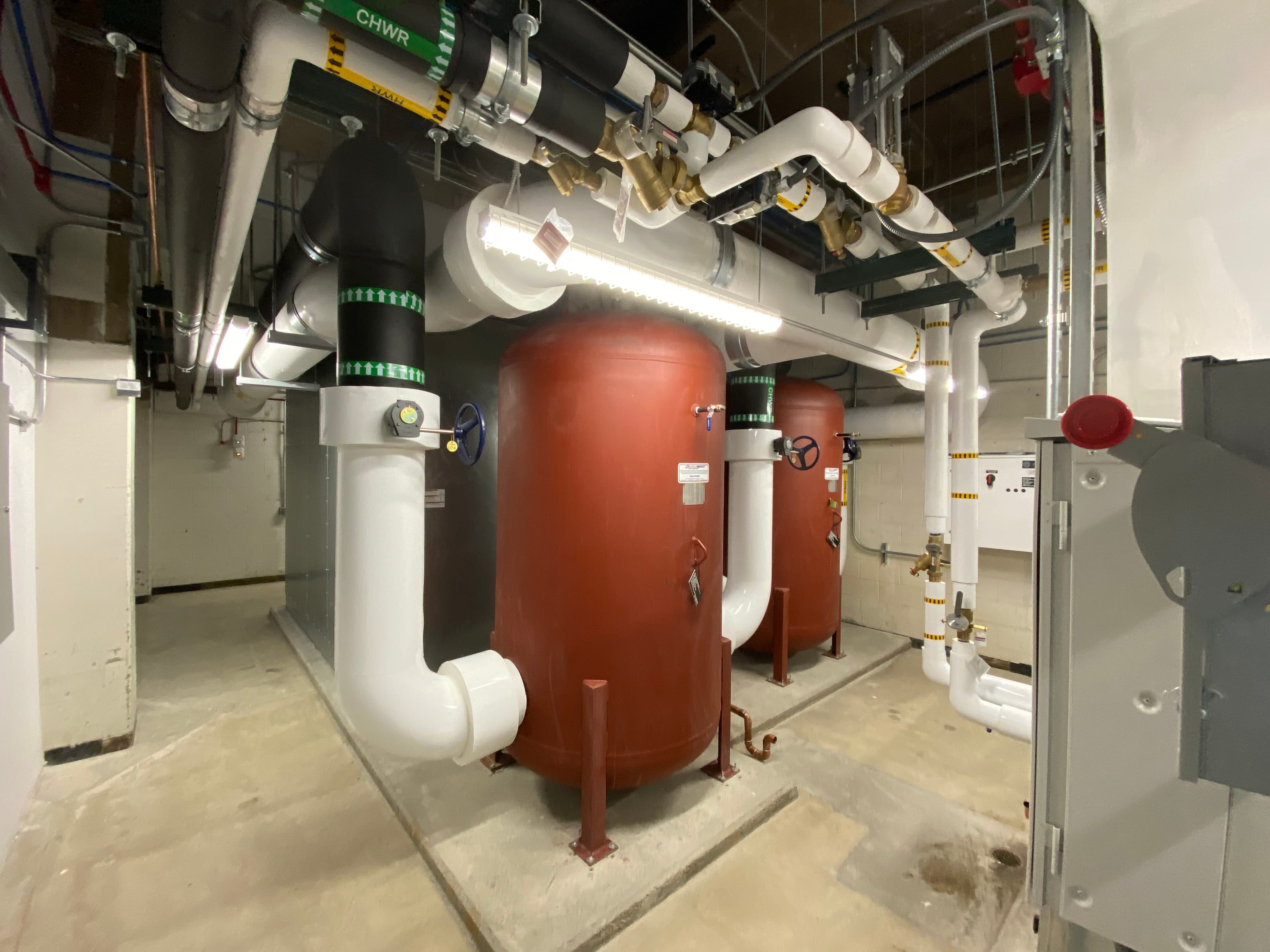 Tanks and piping in mechanical room